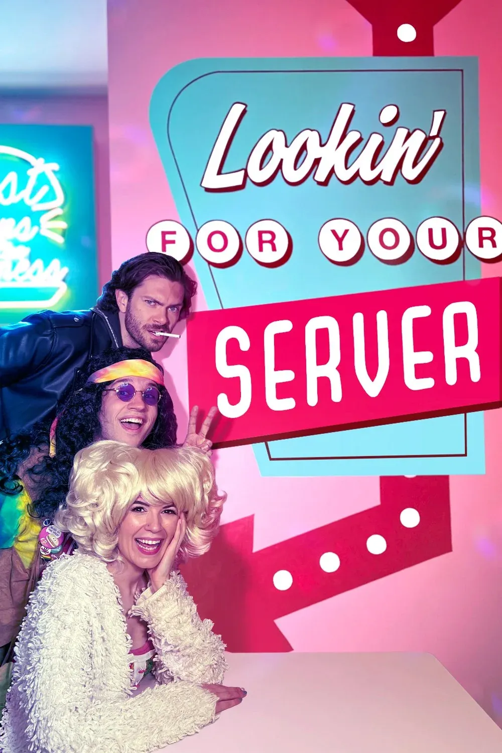 Smiling Ed Debevic’s servers in retro costume behind a counter of classic diner food.